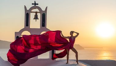 Sunset photoshoot with a model in Santorini, Greece