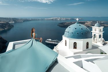 Blue domes flying dress photoshoot in Santorini, Greece