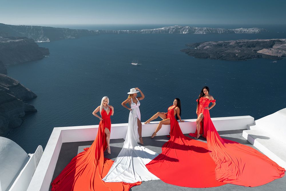 Group flying Santorini dress photoshoot