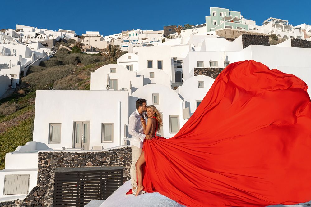 Flying red Santorini dress photo with white houses
