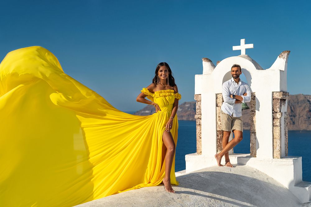 Yellow flying dress photoshoot in Oia, Santorini