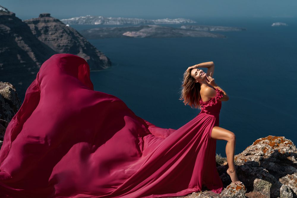 Karolina Wozniak photoshoot with a flying dress in Santorini, Greece