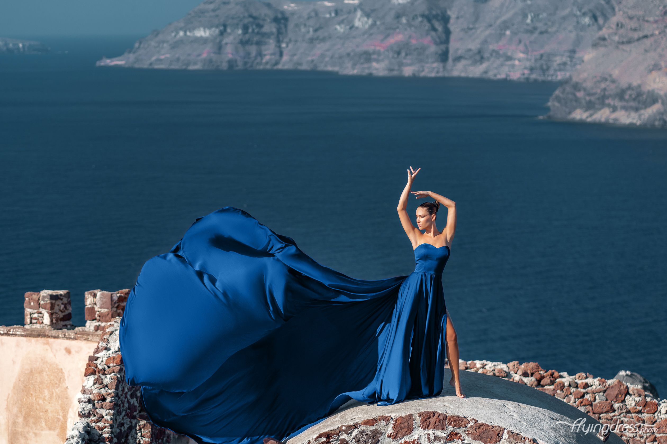 Flying dress photoshoot in Oia village, Santorini