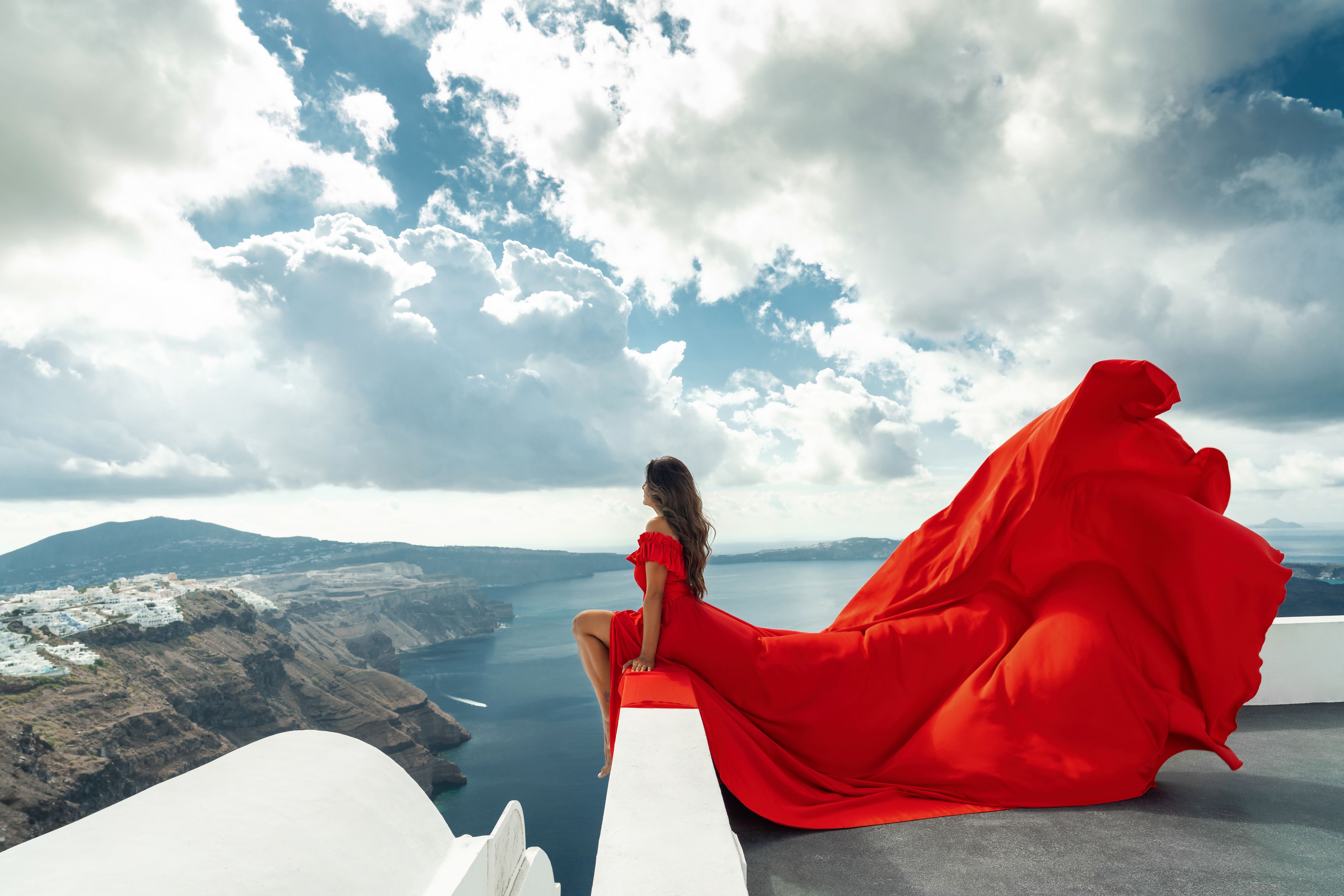 Flying dress photoshoot in Santorini
