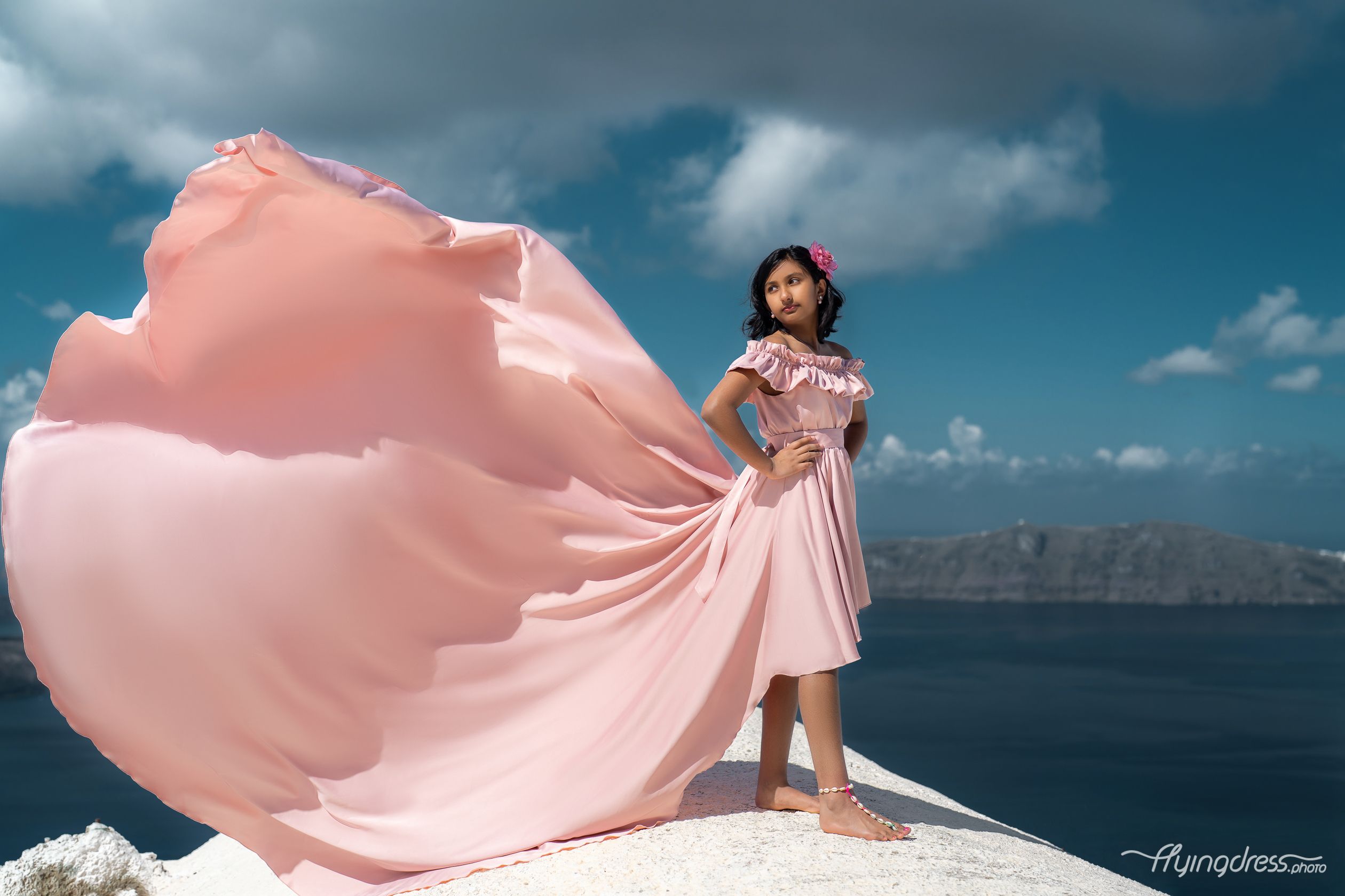 Dusty pink kid flying dress photoshoot in Santorini