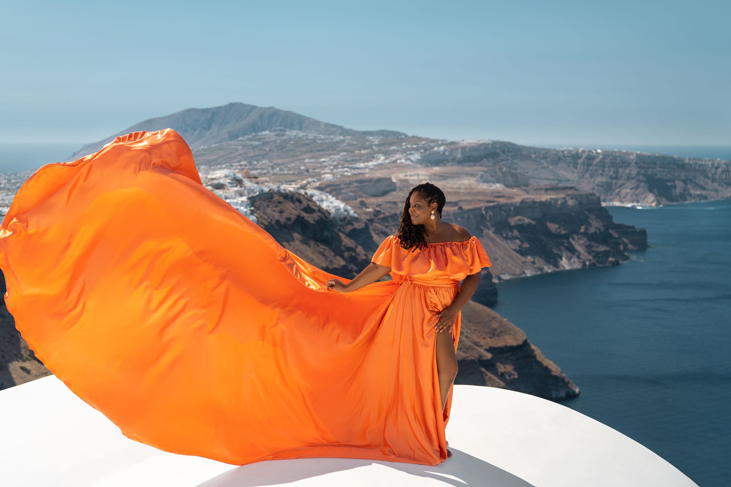Orange XL flying dress photoshoot in Santorini, Greece