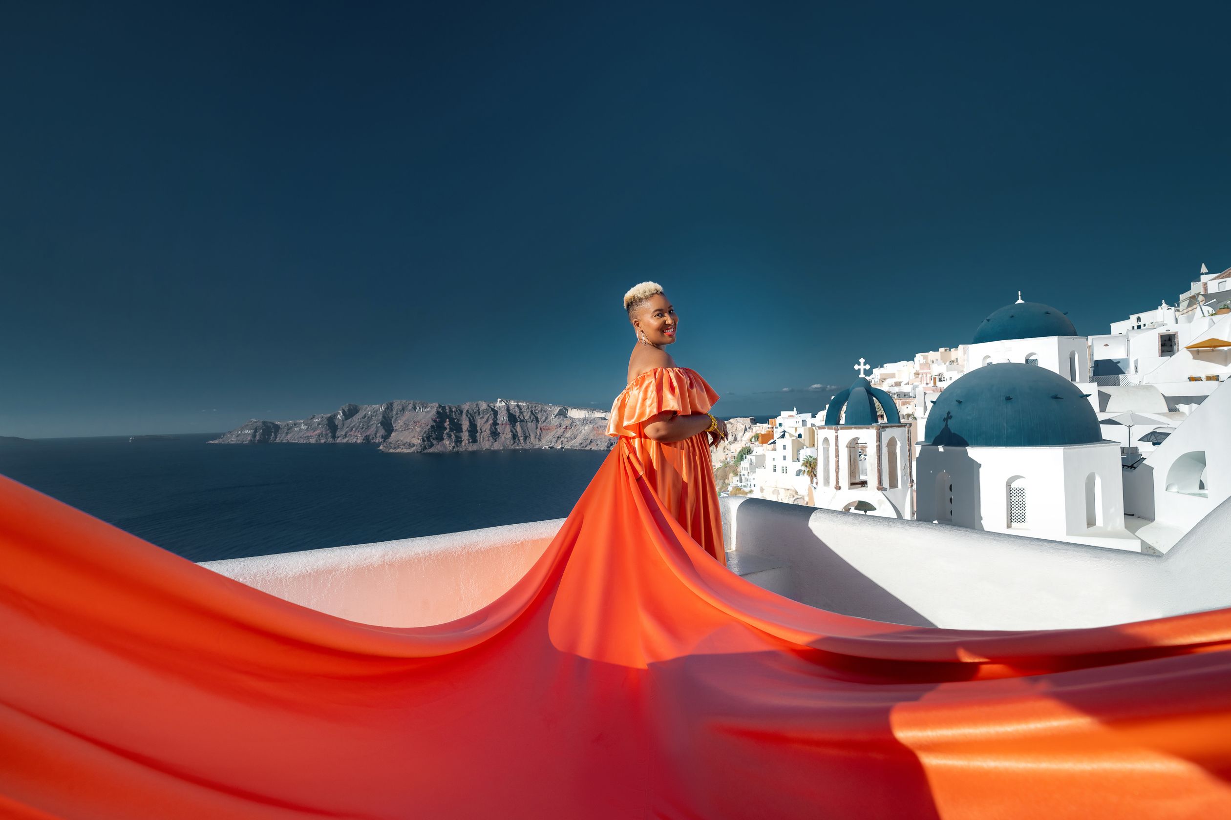 Flying dress photoshoot in Oia, Santorini