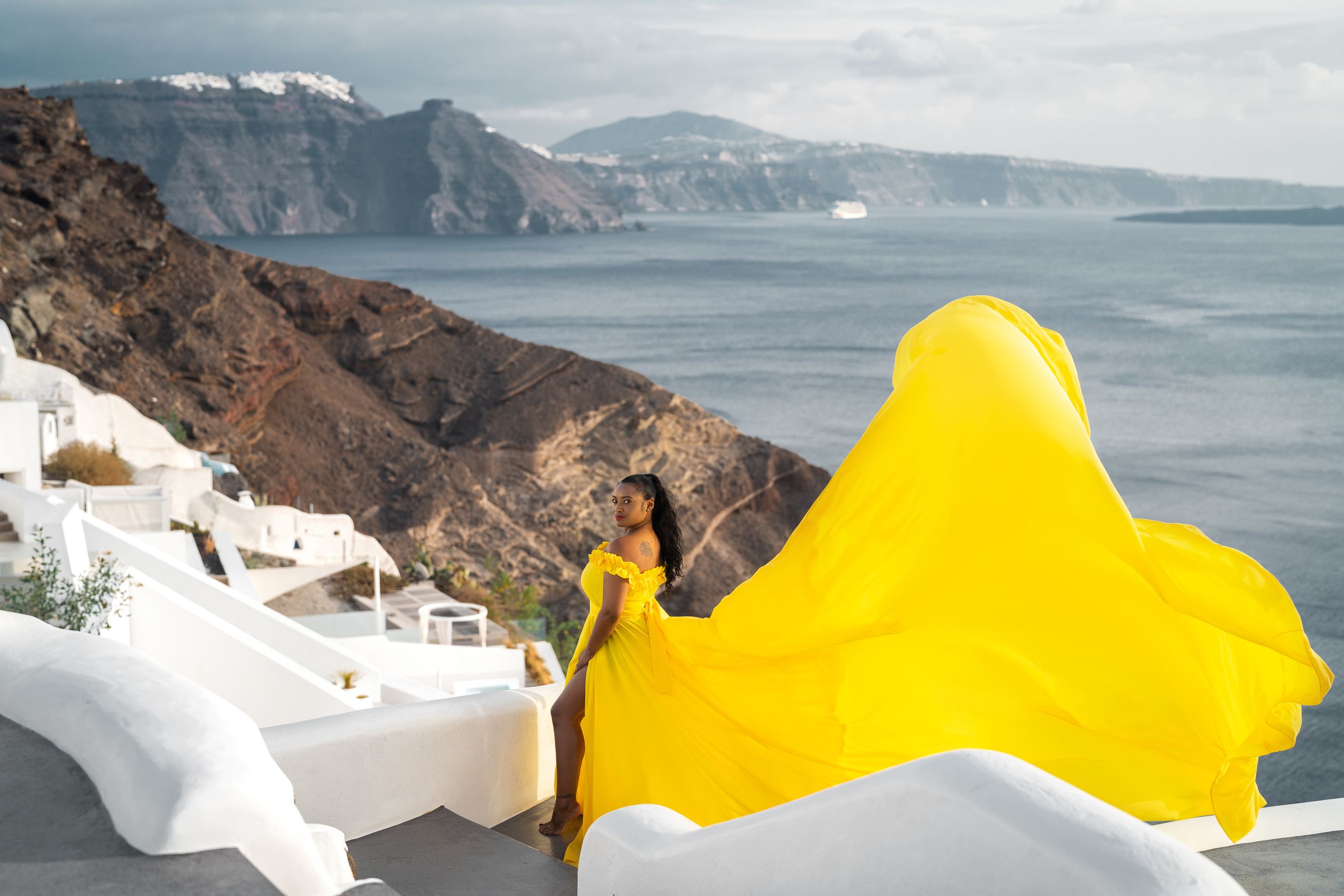 Oia village flying Santorini dress shoot