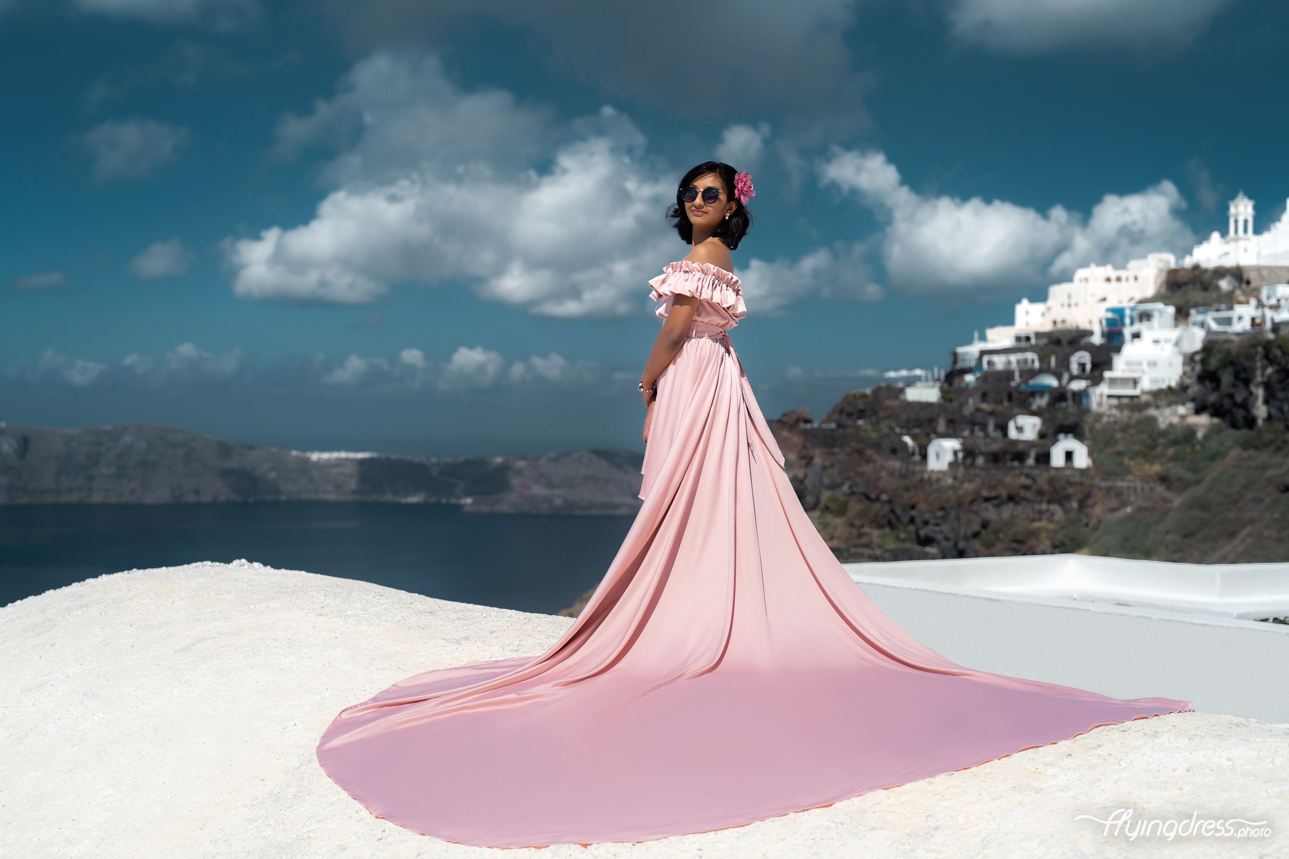 Dusty pink kid flying dress in Santorini