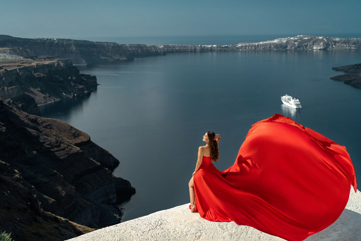 Red flying corset dress photoshoot in Santorini, Greece