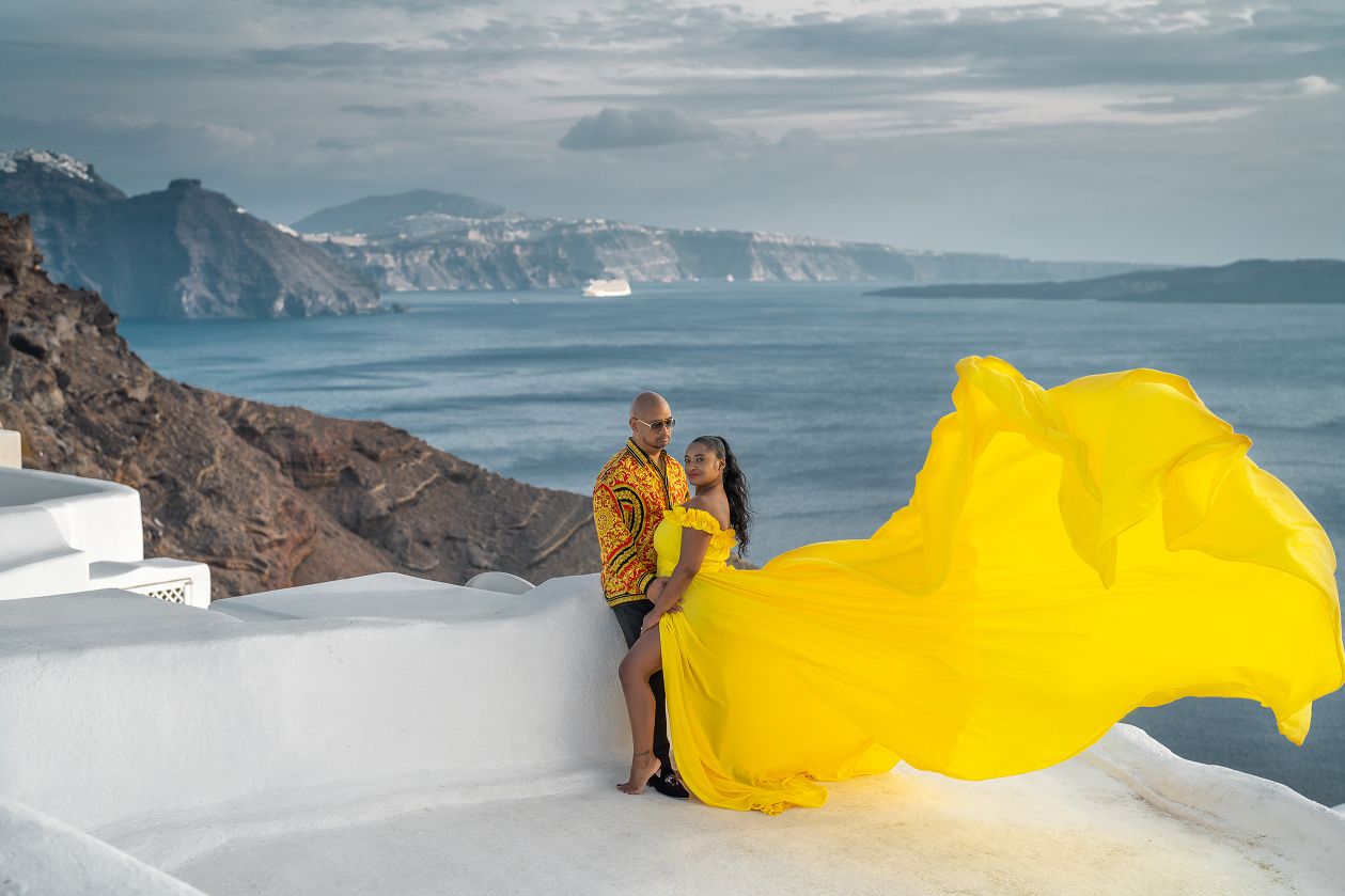 Yellow flying dress shoot in Finikia (close to Oia) Santorini
