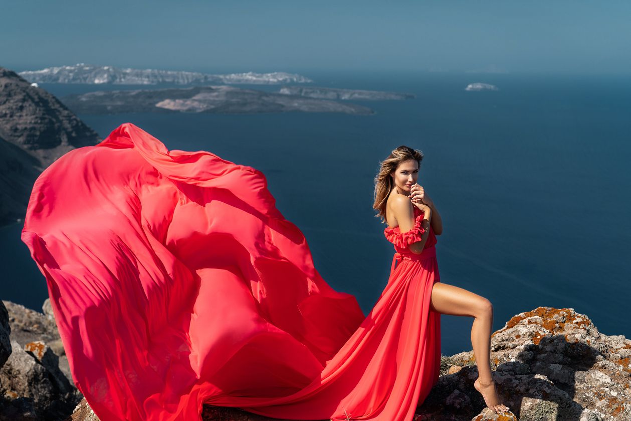 Santorini flying coral dress photoshoot with a nice model