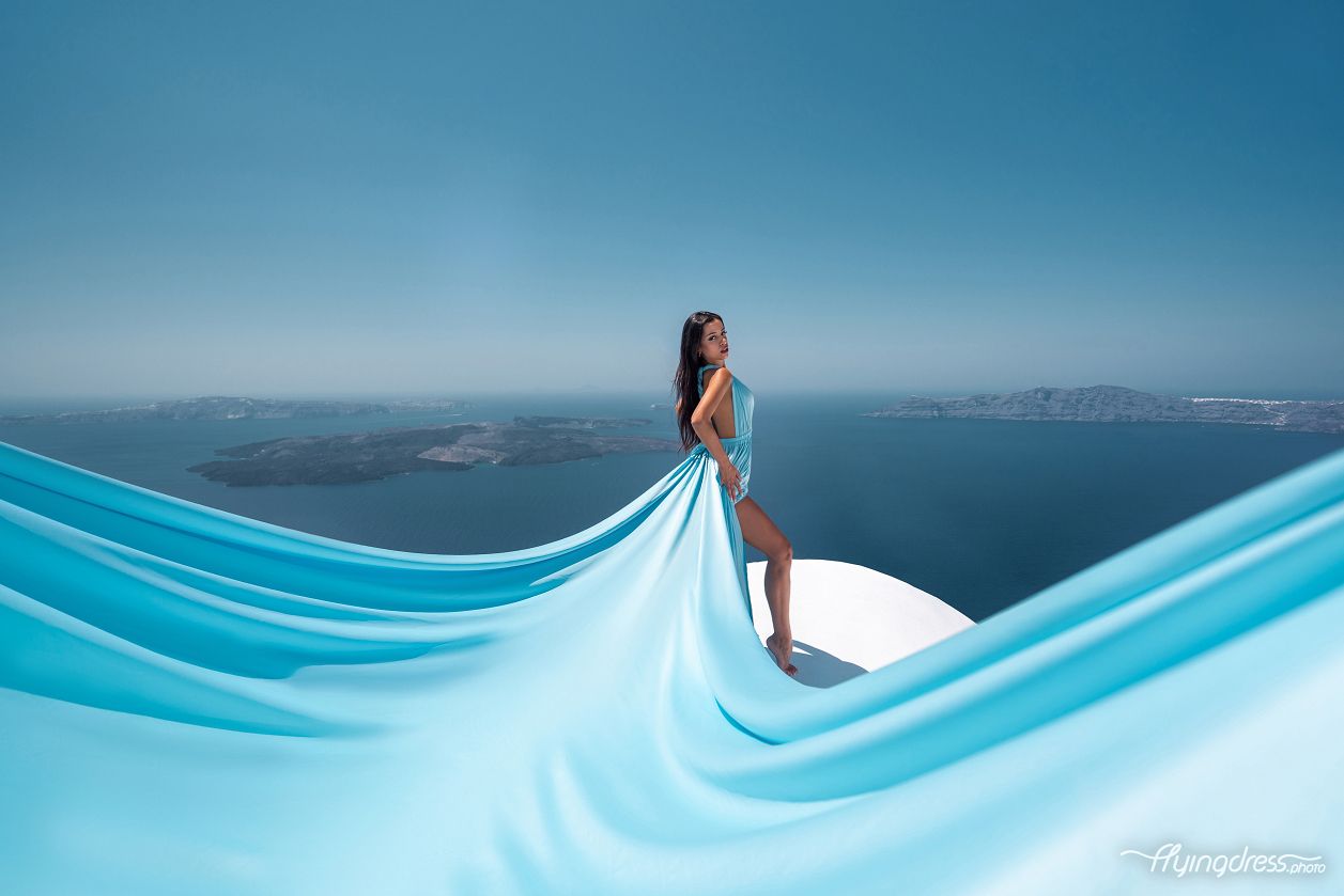 Flying dress photoshoot with a pro photographer in Santorini