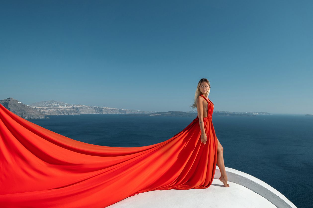 Red flying Santorini dress photoshoot