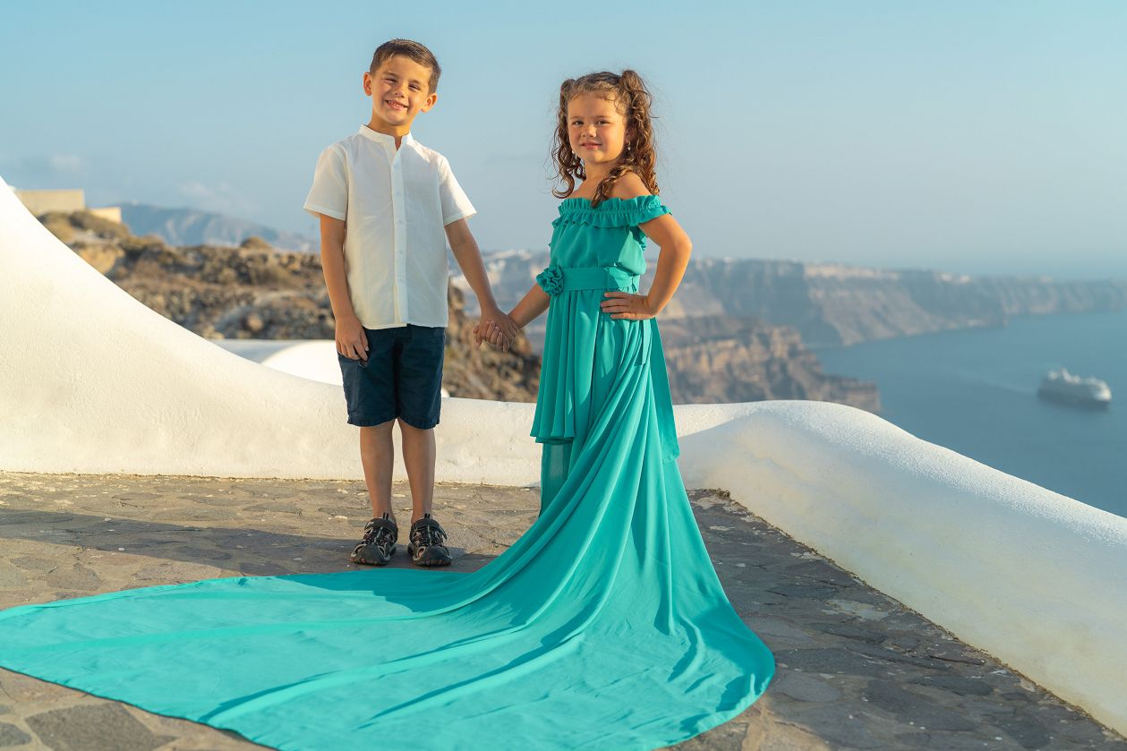 Brother and sister flying dress shoot in Santorini