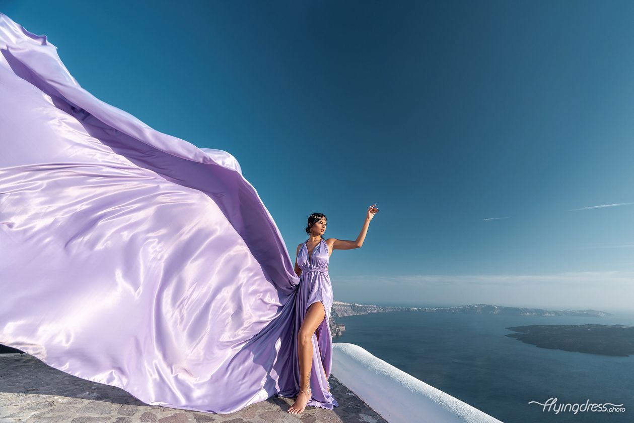 Photoshoot with a lilac flying dress in Santorini