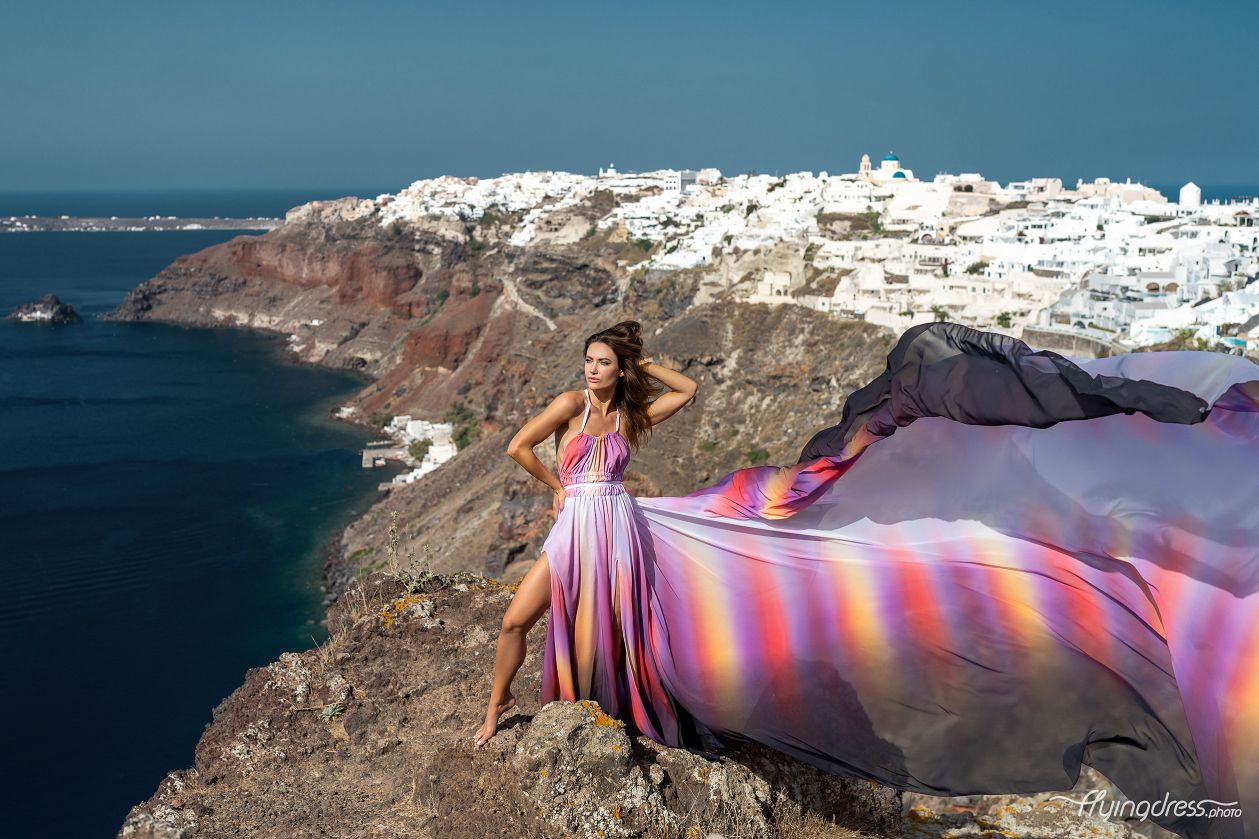 Photoshoot in Oia village with a flying dress