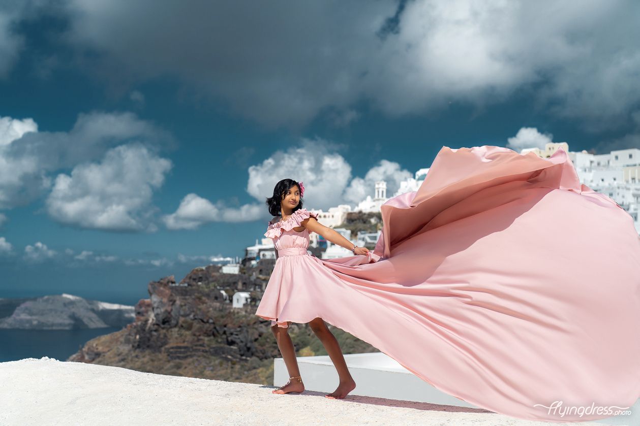 Flying dress photoshoot in Santorini with kid