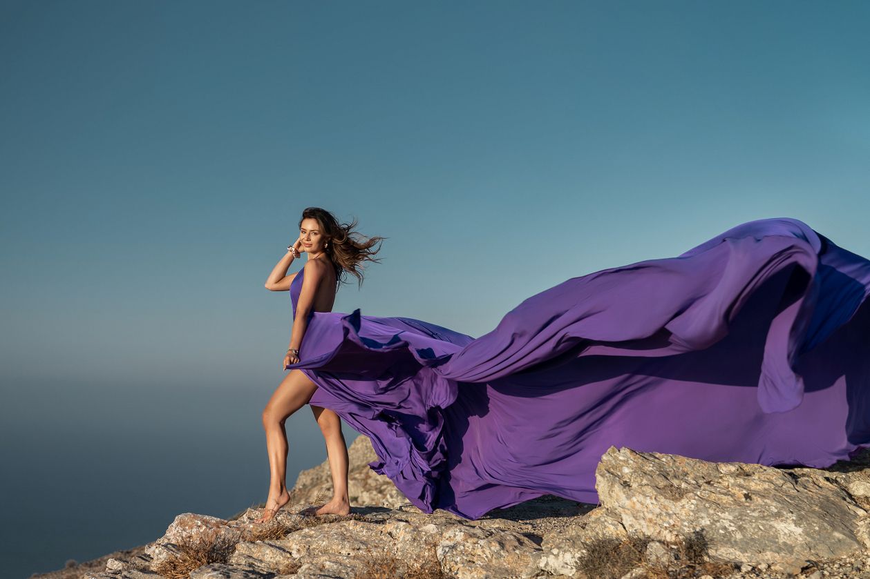 Purple flying Santorini dress photoshoot