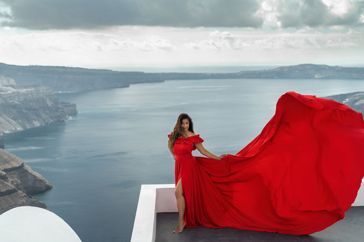 Red flying dress photoshoot in Santorini, Greece