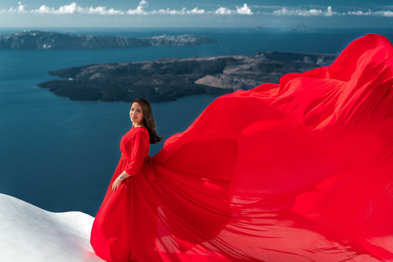 Long sleeve red flying dress photoshoot in Santorini, Greece