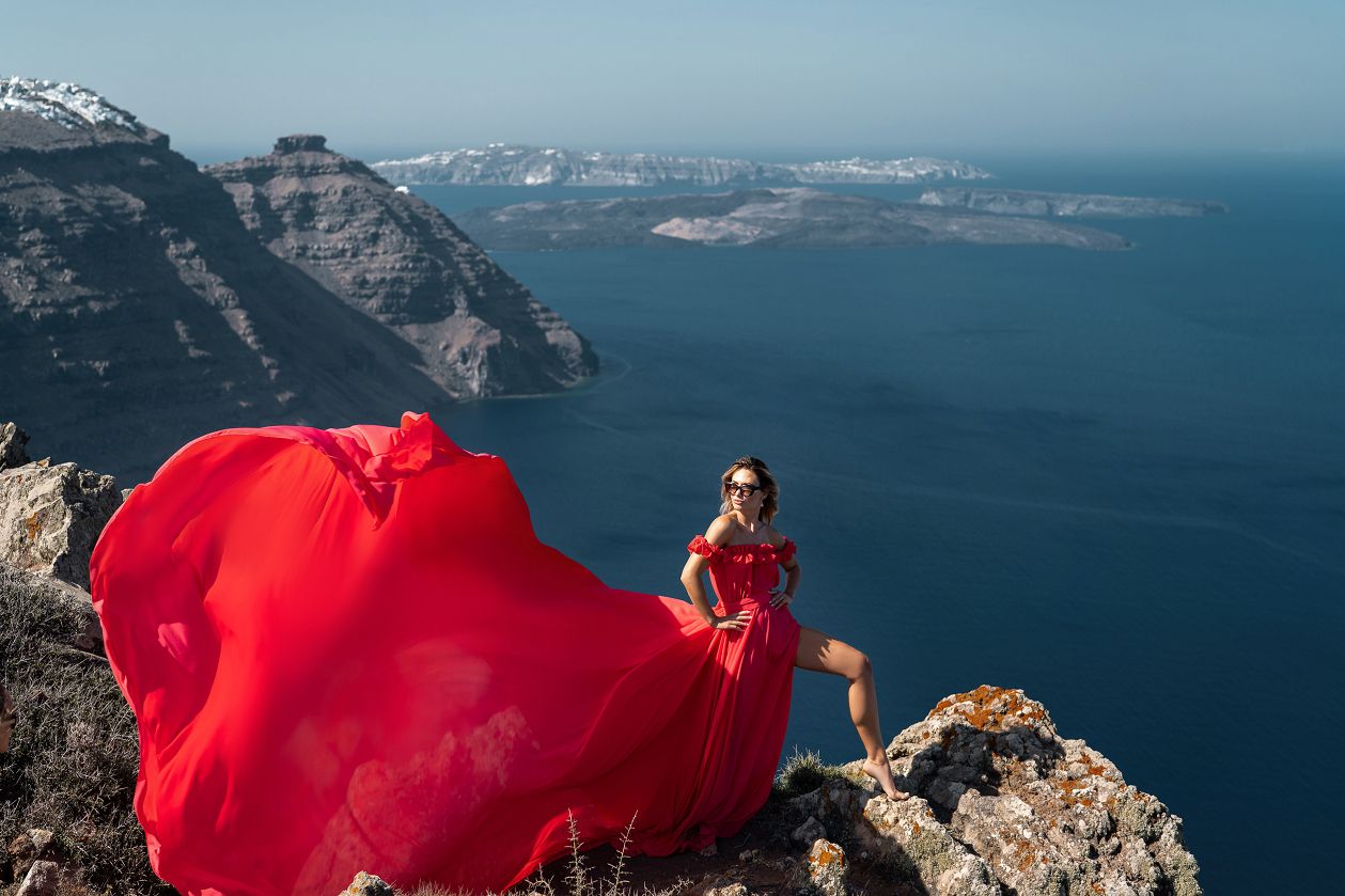 Santorini flying dress photoshoot with caldera view