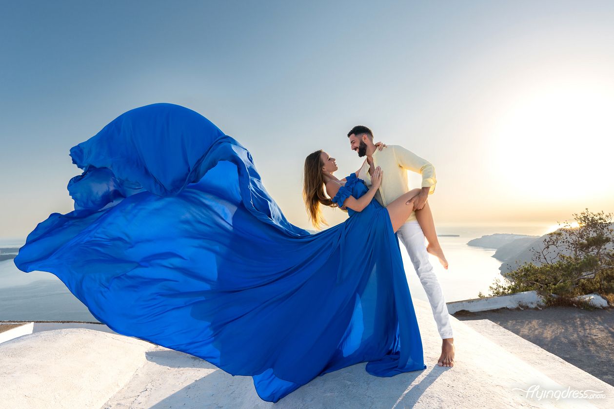 Couple photoshoot with a flying Santorini dress
