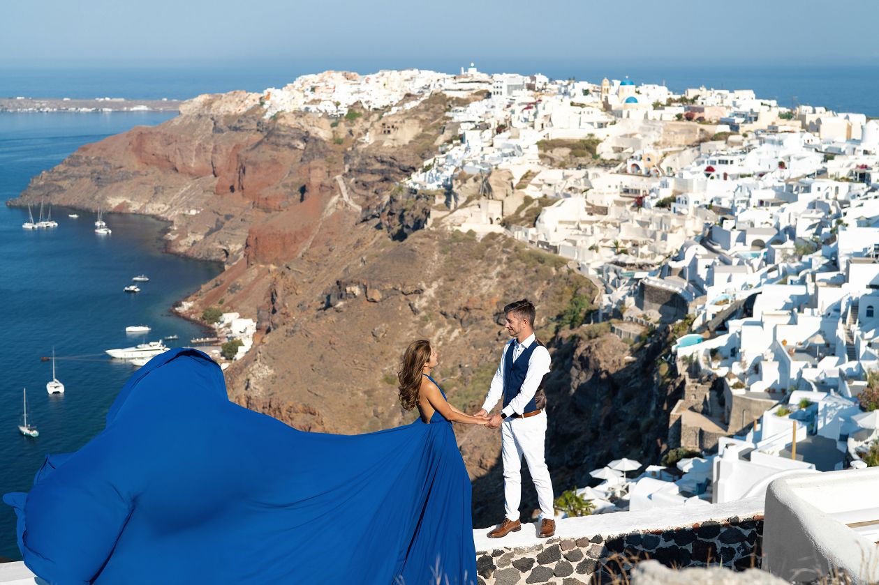 Royal blue flying Santorini dress shoot