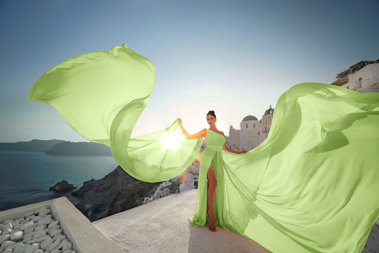 Photoshoot with a flying Santorini dress in Oia village