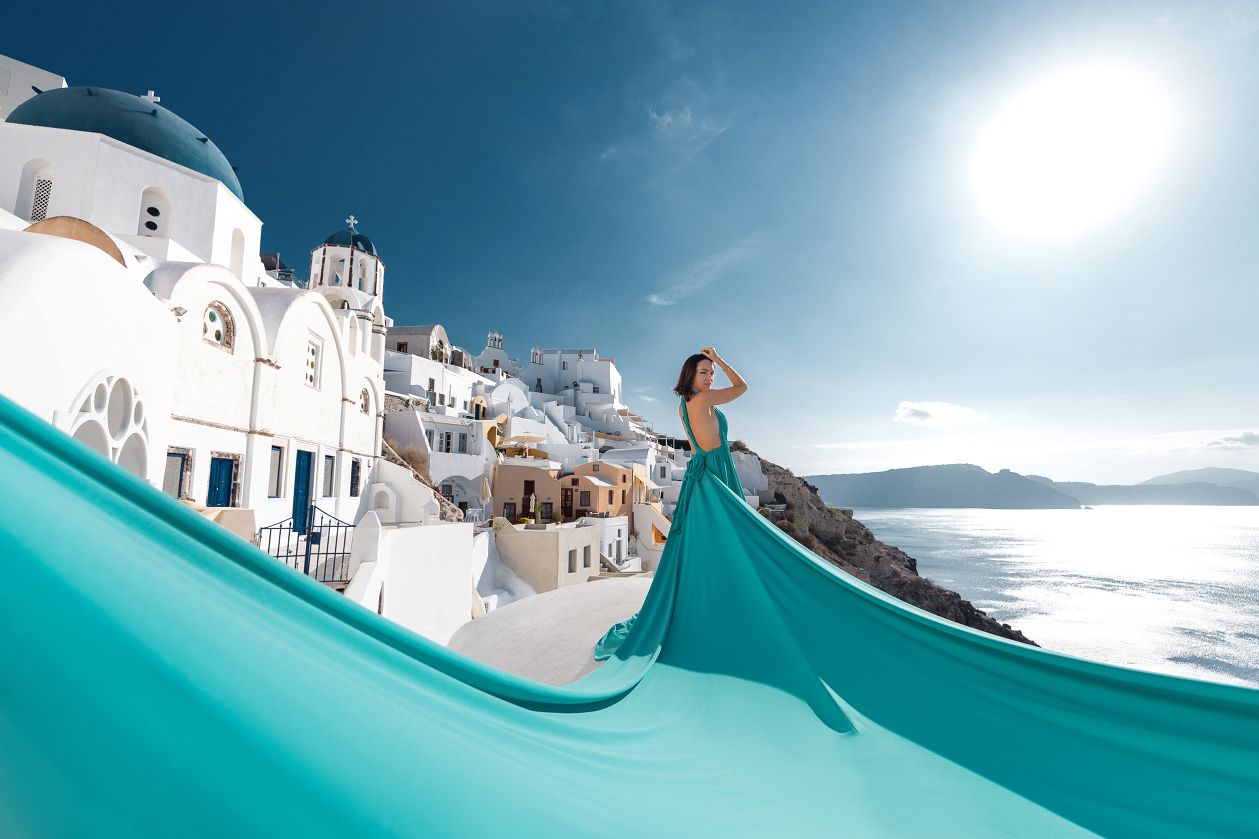 Santorini dress photoshoot in Oia with blue domes