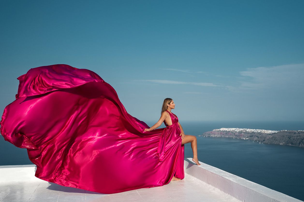 Flying Santorini dress photoshoot in Imerovigli, Greece