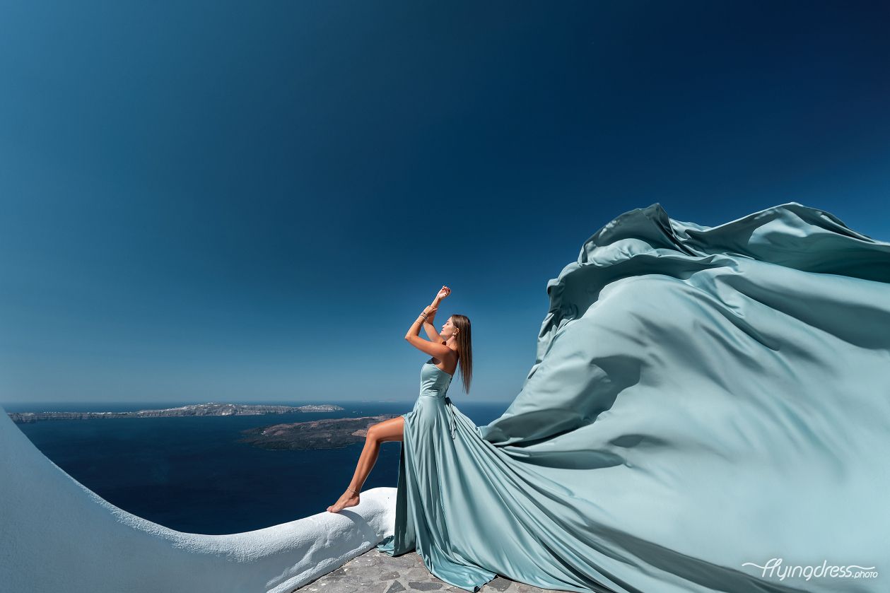 Santorini Dress photoshoot with caldera and volcano view