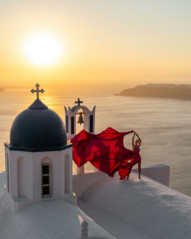 Sunset photoshoot in Santorini with a blue dome