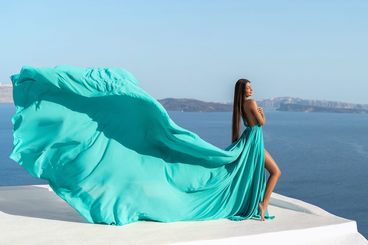 Photoshoot in Oia village with a tiffany blue Santorini dress