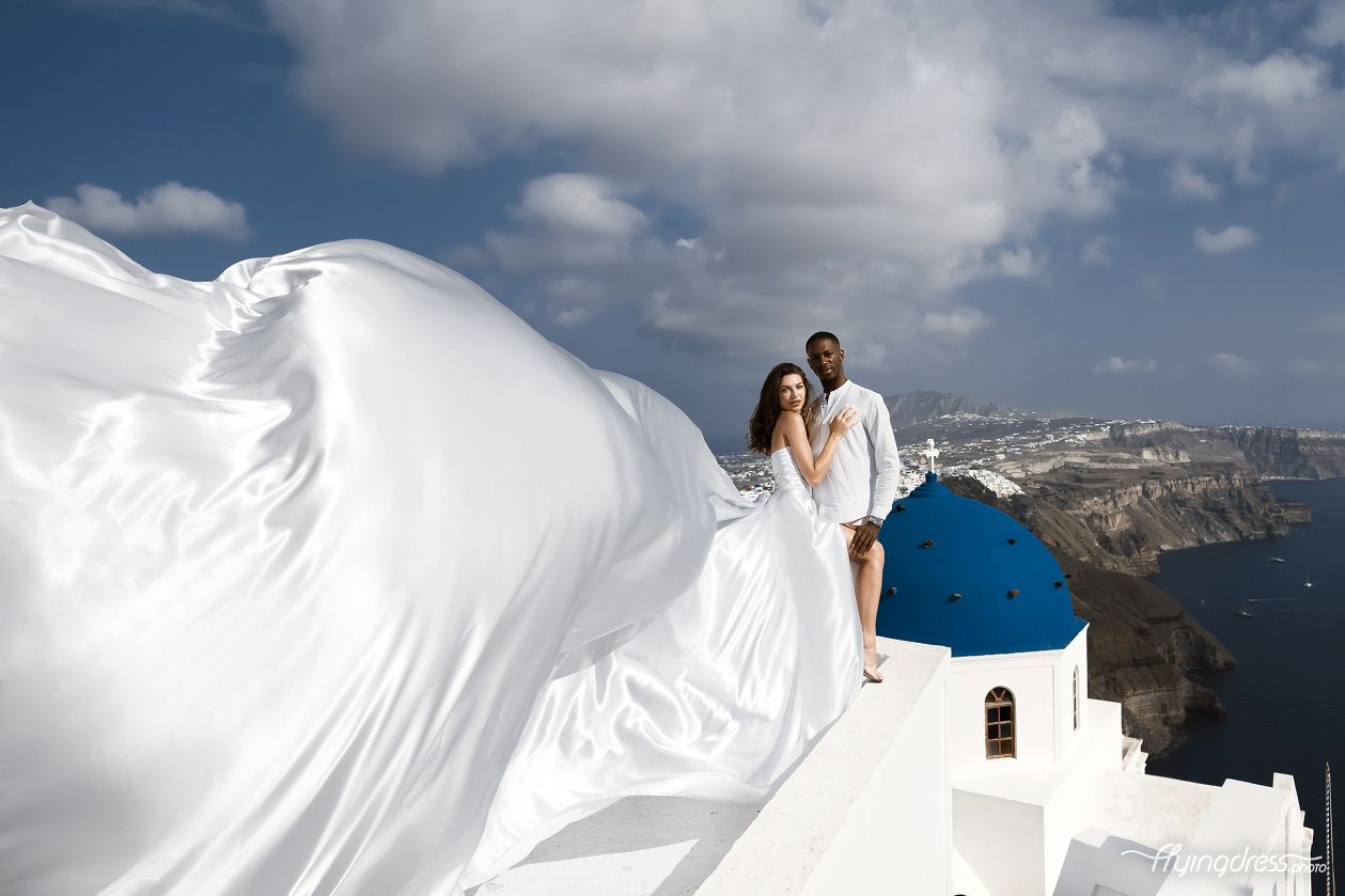 Wedding photoshoot close to the blue domes in Santorini