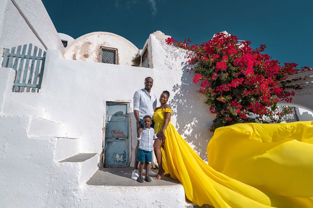 Yellow flying Santorini dress photoshoot with kid