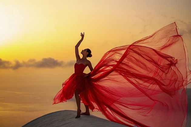 Sunset flying dress photoshoot in Imerovigli, Greece