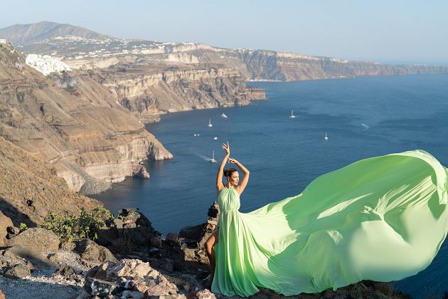 Light green flying dress shoot in Imerovigli, Santorini