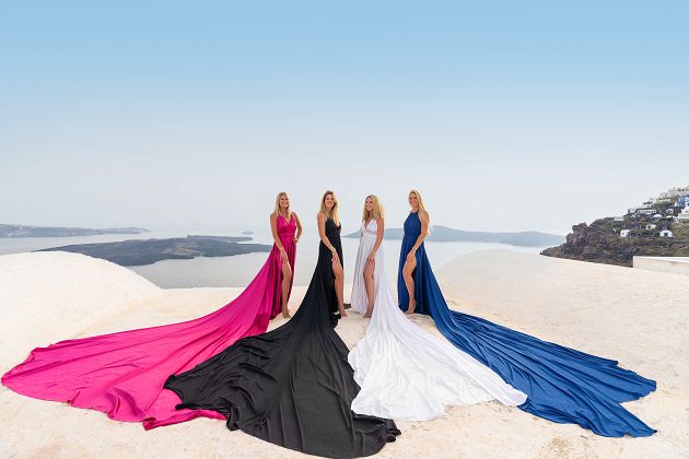Group flying dress photoshoot in Santorini, Greece