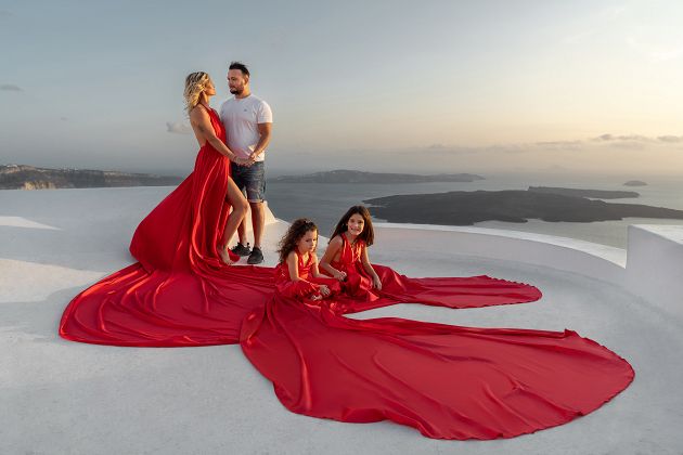 Santorini sunset family photoshoot with a long dresses