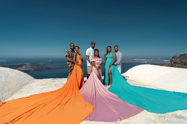 Group flying dress photoshoot in Santorini