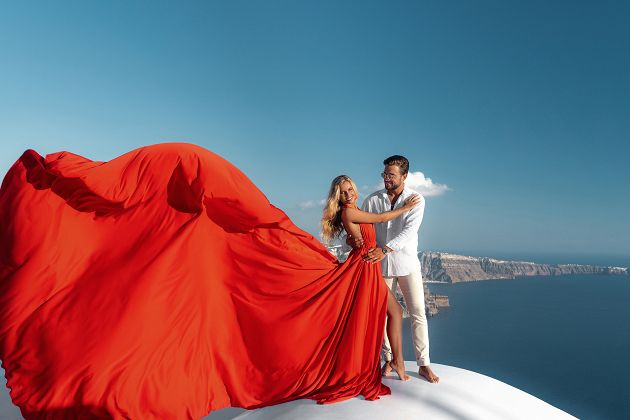 Santorini red flying dress couple photoshoot