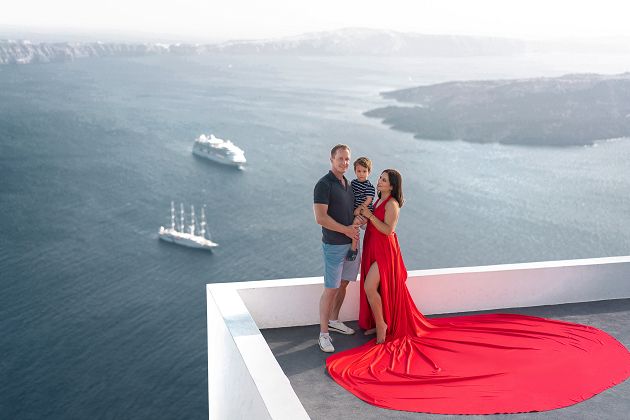 Family flying dress photoshoot in Santorini, Greece