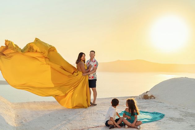 Family flying Santorini dress photoshoot with kids