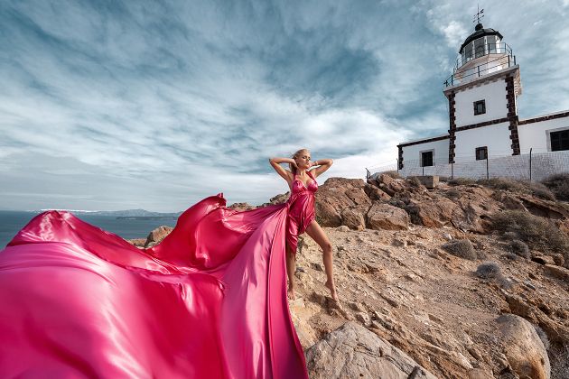 Santorini flying dress photoshoot at the lighthouse