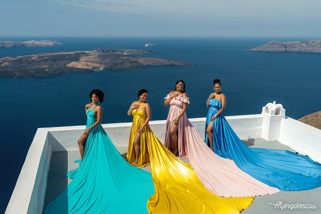 Santorini flying dress group photoshoot in Imerovigli, Greece