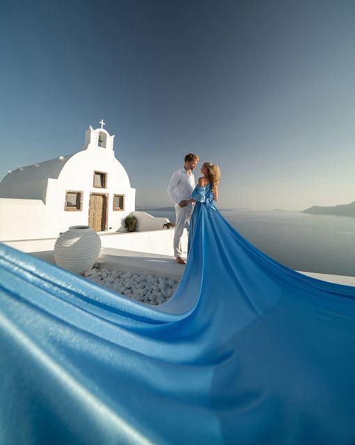Flying dress photo with caldera view in Santorini, Greece