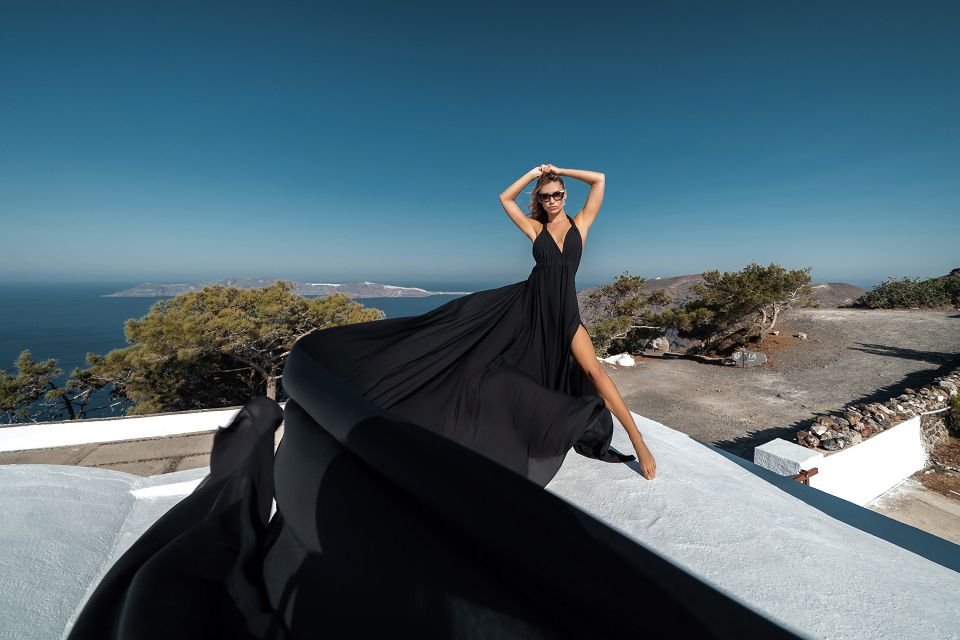 Black flying dress photoshoot in Prophete Elias church, Santorini