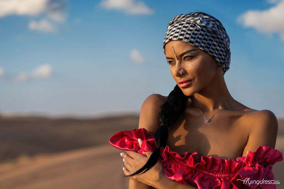 In the serene embrace of the desert, a model's close portrait unveils a captivating blend of beauty and tranquility.