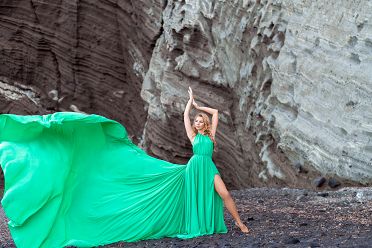 Green flying Santorini dress photo at the black beach